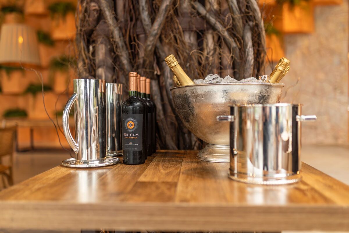 Champagne on ice and wine bottles brought to the table